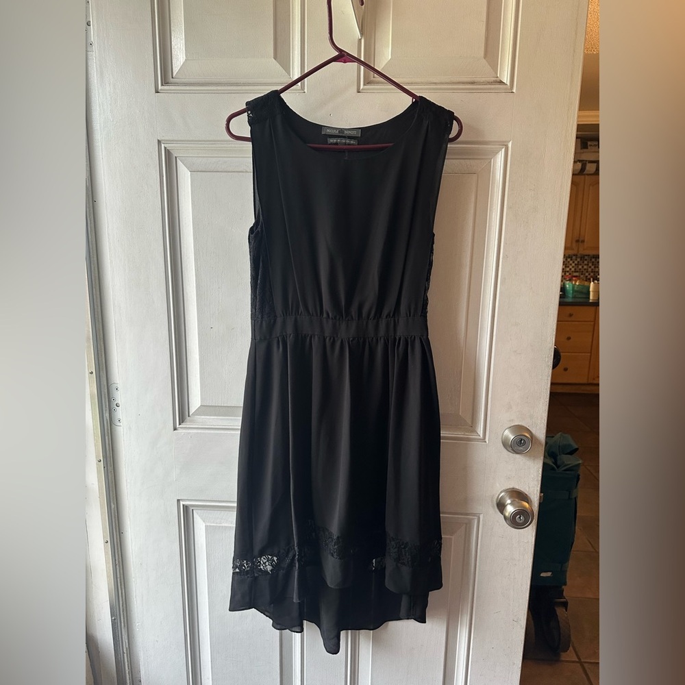 Nicole Benisti sleeveless black dress featuring lace detailing